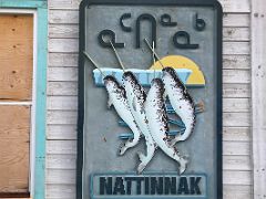05B Entrance Sign For Nattinnak Visitors Centre Has Carved Narwhals In Pond Inlet Mittimatalik Baffin Island Nunavut Canada For Floe Edge Adventure